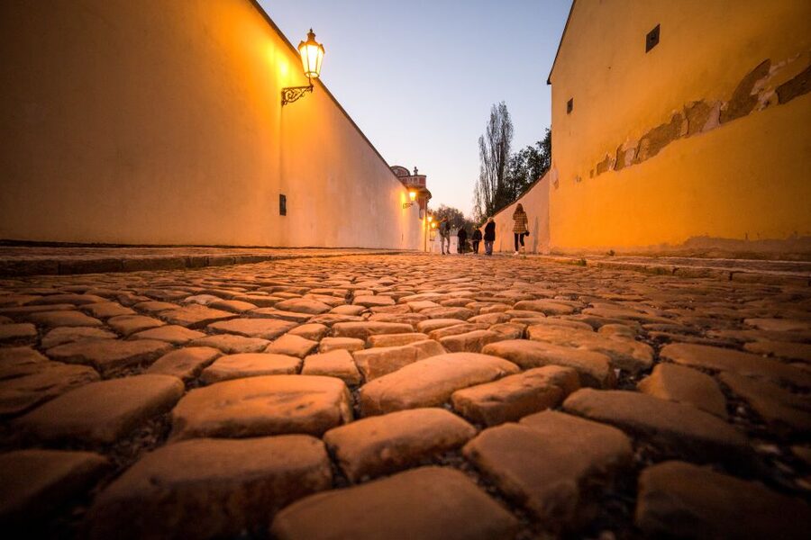 Alchemy and Mysteries of Prague Castle Walking Tour - Prague Castle front gate and St. Vitus spires: the night reveal