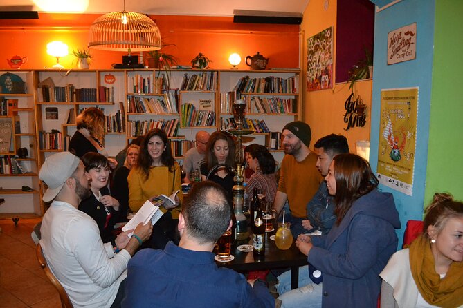 Alternative bar tour with dinner in the art district - A gas-lit neighborhood bar and champagne, then Letná Field history