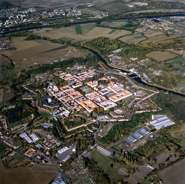 From Prague: All-inclusive Bus Tour to Terezin Memorial - Small Fortress and crematorium-style stops: where the history turns physical