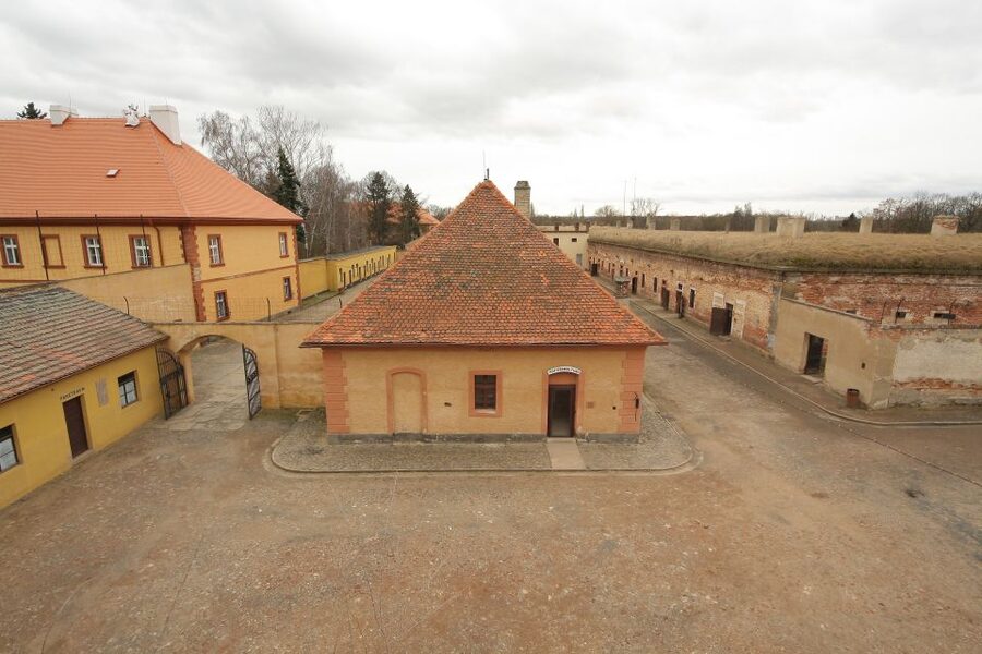 From Prague: All-inclusive Bus Tour to Terezin Memorial - Main camp complex walk: understanding living, suffering, and survival