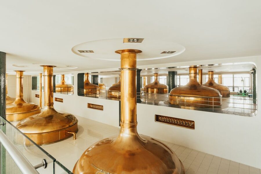 Pilsen: Pilsner Urquell Brewery Tour with Beer Tasting - How the tour moves from the Visitor Center to the working brewery