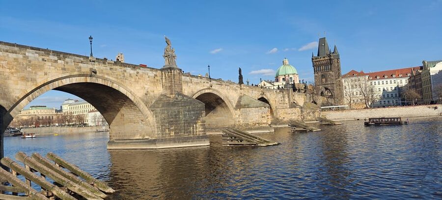 Prague: 2-Hour Historic Boat Cruise with Delicious Lunch - Prague landmarks from the water: Charles Bridge arches and the castle panorama