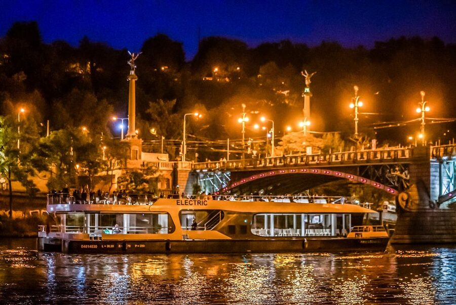 Prague: 50-Minute Sightseeing Evening Cruise - Audio guide that keeps up, plus printed and app backups
