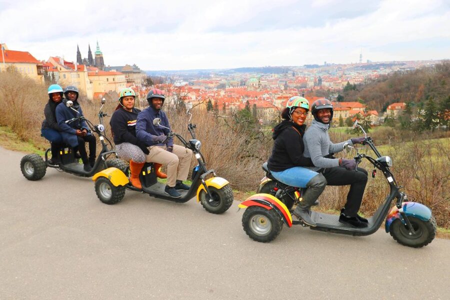 Prague: City Highlights Guided Electric Trike Tour - The Charles Bridge ride-under moment: the payoff at the end