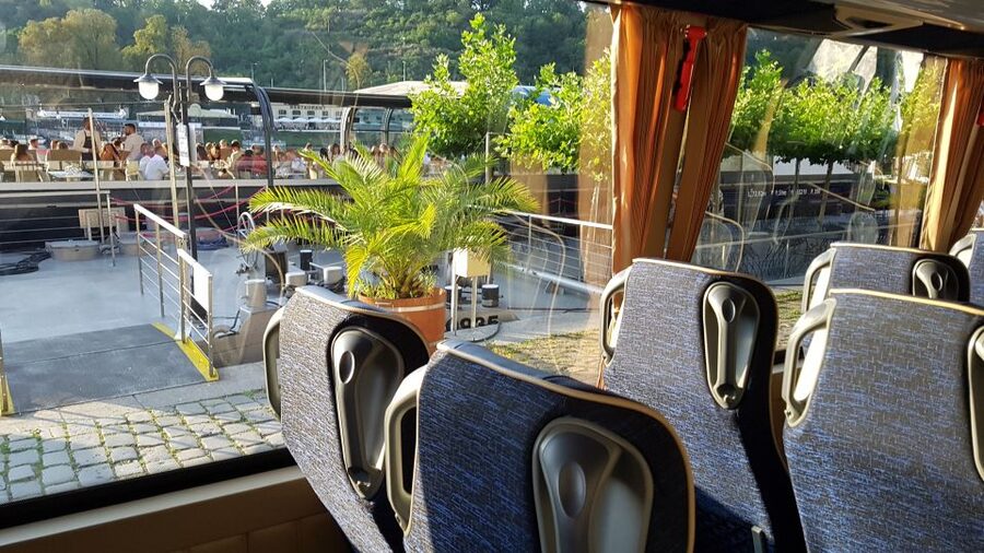 Prague: City Tour and Dinner Cruise with Hotel Pickup - Boarding the Boat: Welcome Drink, Live Music, and Buffet Setup