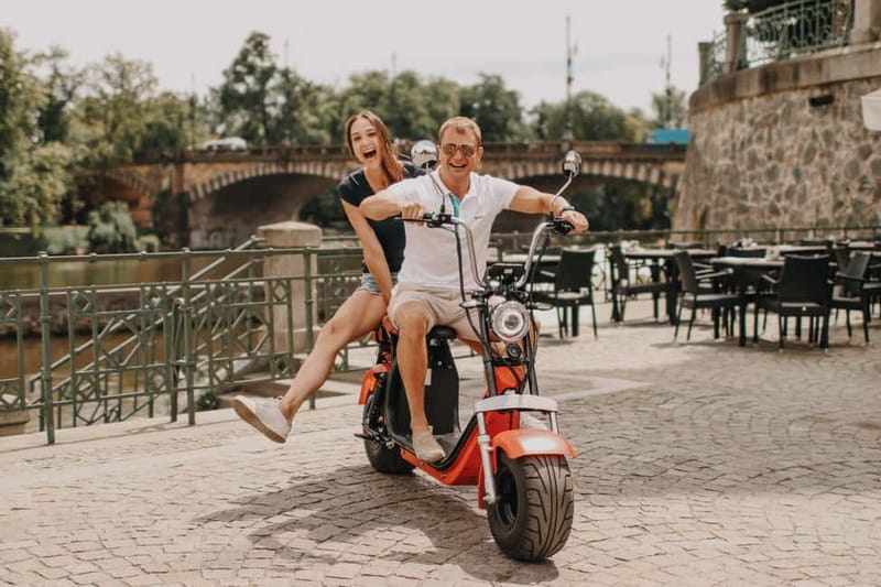 Prague: Guided Fat Tire e-Scooter Tour - Hradchanska Square to Prague Castle without the foot-travel fatigue