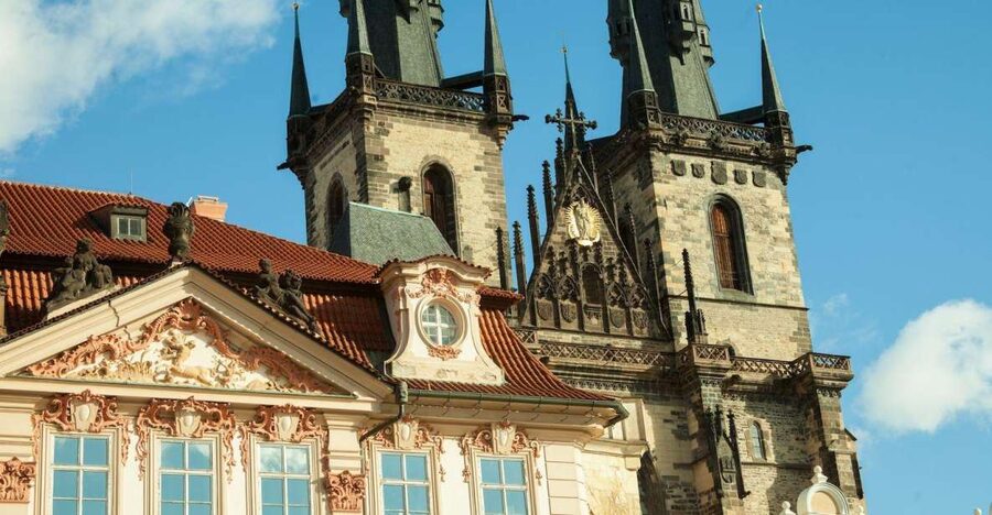 Prague: Old Town and Jewish Quarter Guided Tour in German - Clementinum and New Town Hall exteriors: a smarter bridge to Charles Bridge
