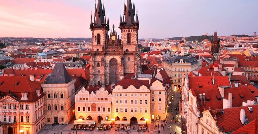 Prague: Old Town and Jewish Quarter Tour with Jewish Museum - Municipal House, Powder Tower house signs, and St Nicholas’s façade