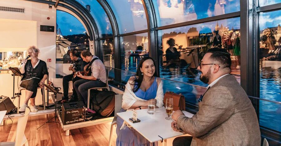 Prague: Sightseeing Dinner Cruise on Open-Top Glass Boat - Open-deck time, locks, and staying comfortable when the wind is real