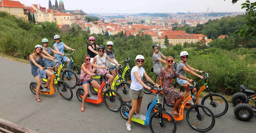 Prague: Tour by Electric Scooter or Cruiser eBike - Pausing at the National Theater area, then threading through Old Town again