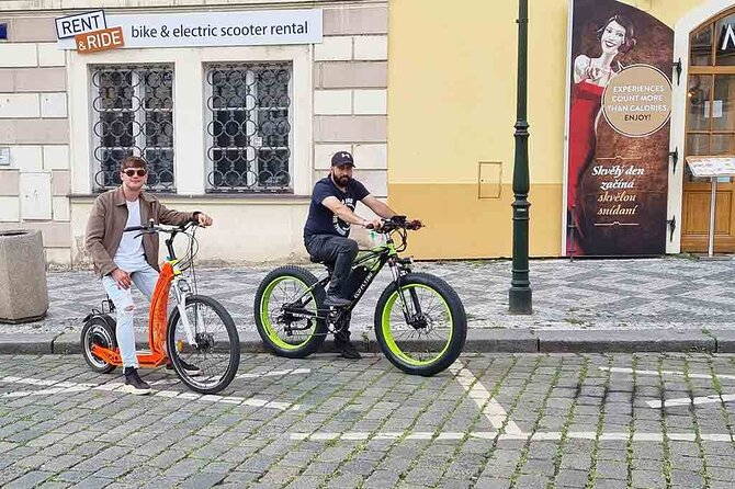 Prague Trike & e-Scooter Tour: Castle Viewpoints & Charles Bridge - Narrow street, Kafka statues, and Rudolfinum in quick succession