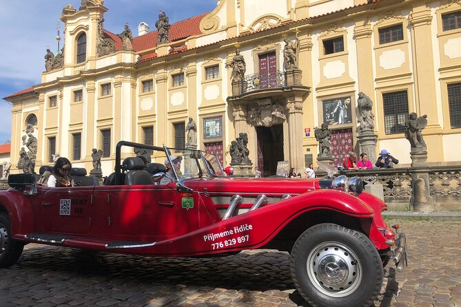 Vintage Cars Prague - Grand City Tour 150min / 1-6 pers. 2,5hrs - Italian-style church, cultural event venue, and the gold-roof building